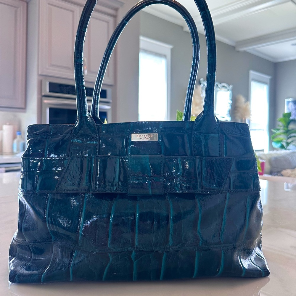 Authentic Kate Spade handbag. Has been carried, but in good used condition.